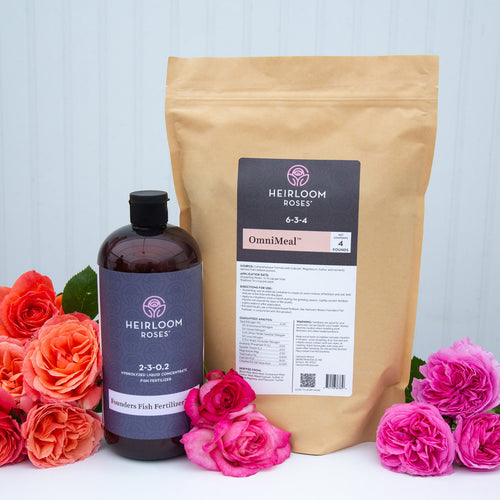 A bundle of soil fertilizers with a bottle labeled 'OmniMeal' and a pouch labeled 'Founders Fish Fertilizer', displayed with pink and orange roses around it.